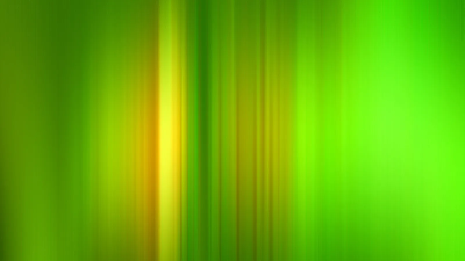 Vertikale, verschwommene Streifen in Grün und Gelb, in der Mitte ein heller gelber Lichtstreifen.