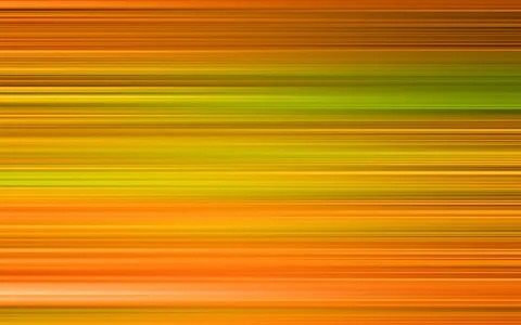 Abstraktes Bild aus waagerechten, verschwommenen Streifen in Orange, Gelb und Grün, die von oben nach unten ineinander übergehen.