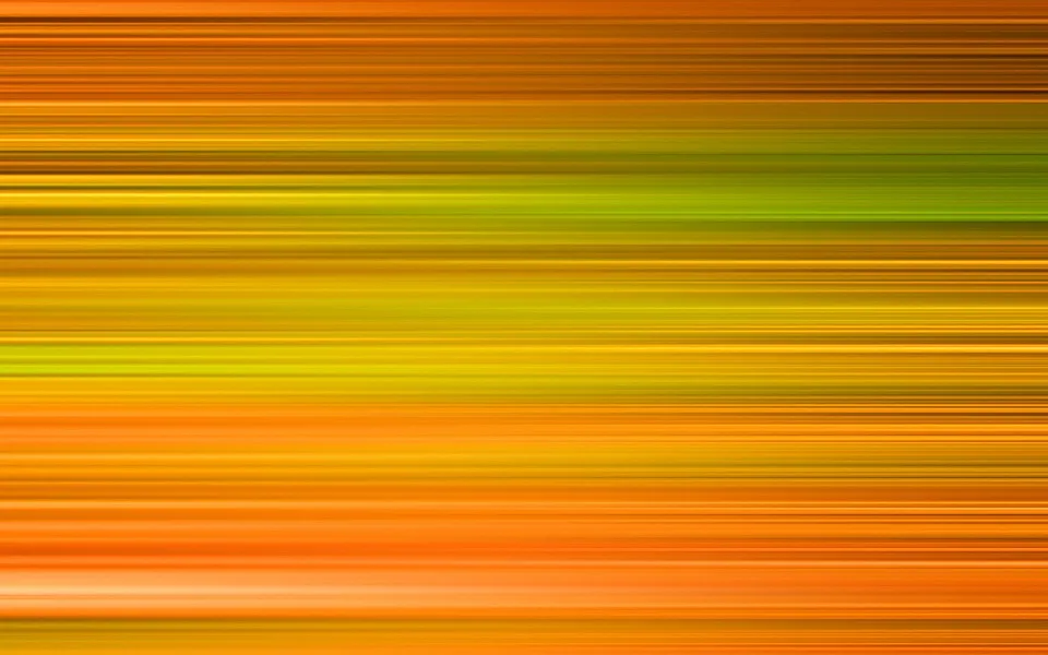 Abstraktes Bild aus waagerechten, verschwommenen Streifen in Orange, Gelb und Grün, die von oben nach unten ineinander übergehen.