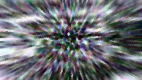 Abstraktes Bild mit radialen Streifen in Violett, Grün und Weiß, die von einem dunklen Zentrum nach außen laufen.