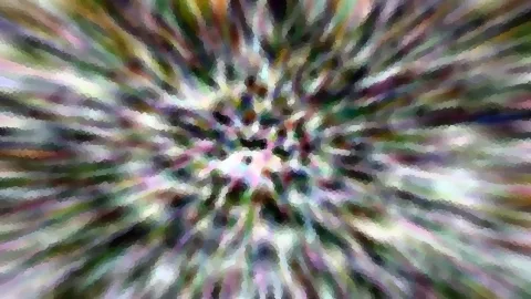 Bunte, radial verwischte Streifen laufen von einem hellen Zentrum in der Bildmitte nach außen, die Kanten wirken leicht pixelig.
