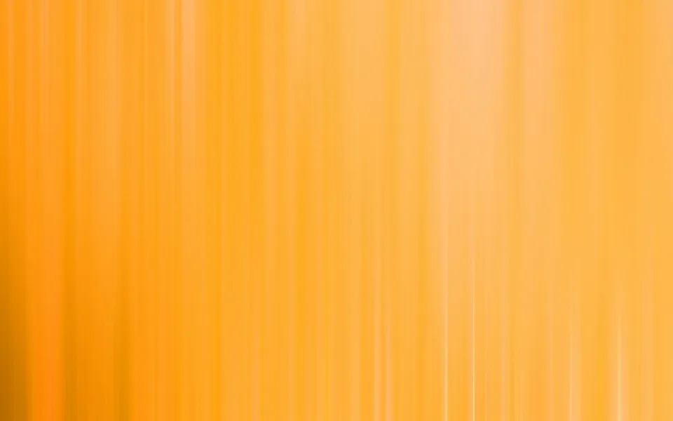 Vertikale, weich verwischte Streifen in Gelb und Orange, die von oben nach unten verlaufen und nach rechts heller werden.
