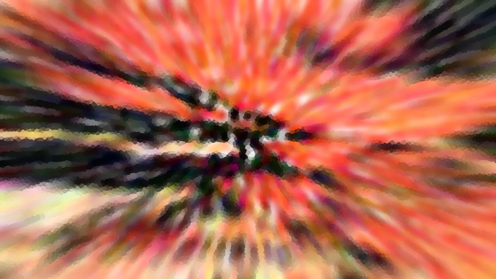 Abstrakte radiale Unschärfe mit orangefarbenen und roten Streifen, die von einem dunklen Zentrum nach außen laufen.