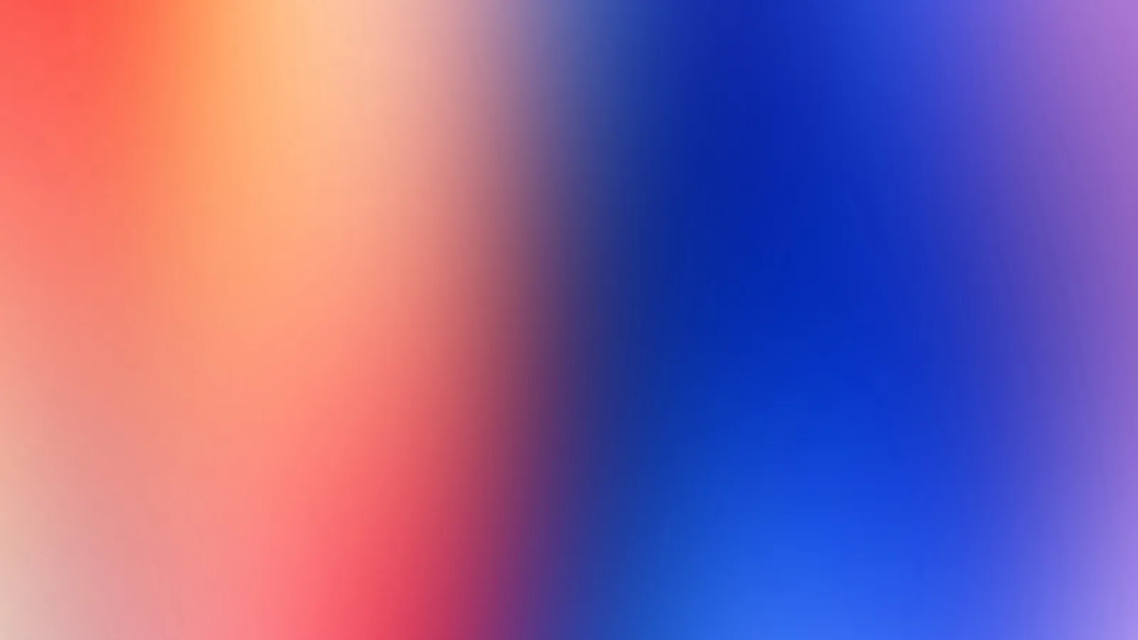 Unscharfer Farbverlauf von Korallenrot und Orange links über Violett bis zu kräftigem Blau rechts