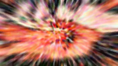 Abstraktes Bild mit radial von einem Zentrum ausgehenden, verwischten Farbstrahlen in Rot, Orange, Weiß und Grün, dunkle Ränder.