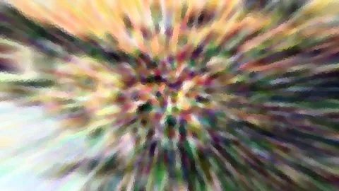 Abstraktes Bild mit bunten Farbstreifen, die von der Bildmitte radial nach außen laufen, mosaikartig verpixelt in Gelb, Grün, Violett und Rosa.