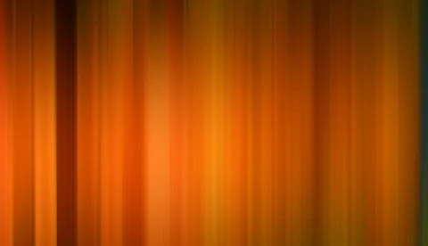 Vertikal verwischte Streifen in Orange, Gelb und Braun, die von links nach rechts ineinander übergehen, am linken Rand ein dunklerer Streifen.