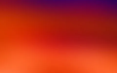 Unscharfer Farbverlauf von Violett oben über Rot in der Mitte bis zu Orange am unteren Bildrand.