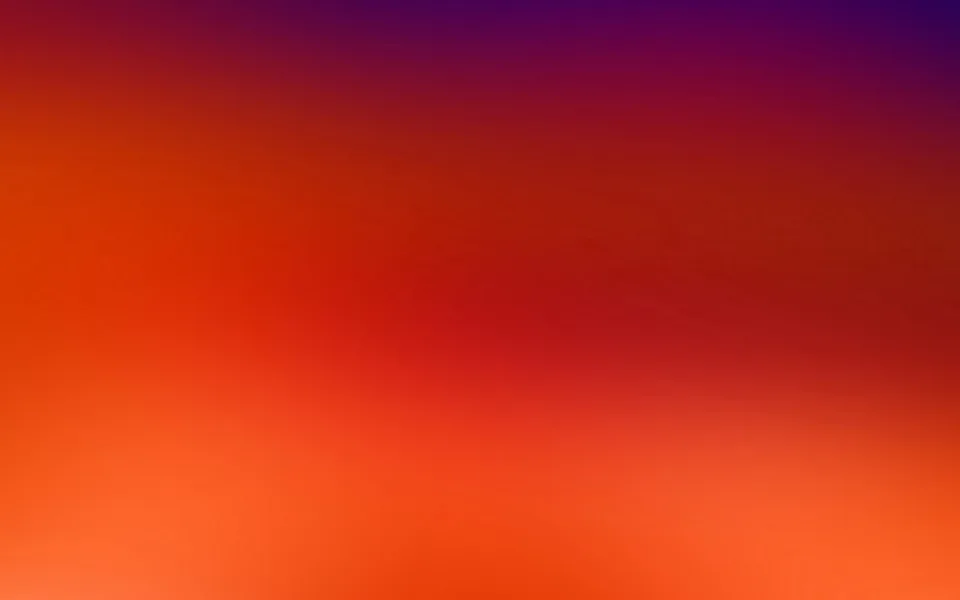 Unscharfer Farbverlauf von Violett oben über Rot in der Mitte bis zu Orange am unteren Bildrand.