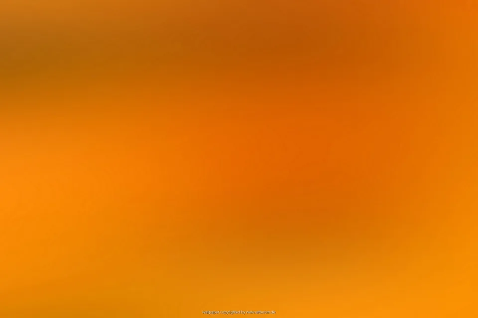 Unscharfer Verlauf in Orange, oben dunkler und unten heller, ohne erkennbare Motive.