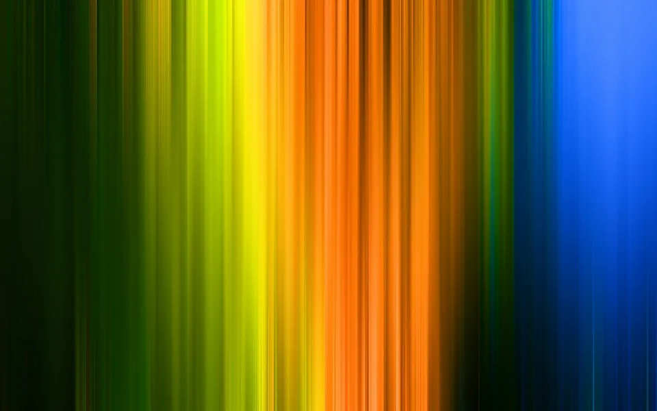 Abstrakte vertikale Streifen in Grün, Gelb, Orange und Blau, die von links nach rechts ineinander übergehen und durch Bewegungsunschärfe verwischt wirken.