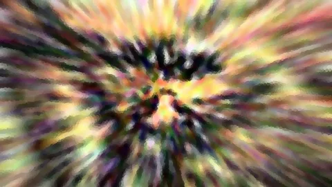 Abstraktes Bild mit strahlenförmiger Zoomunschärfe, die von einem dunklen Zentrum nach außen in Gelb, Rosa, Grün und Violett verläuft, durchzogen von einem groben Pixelmosaik.