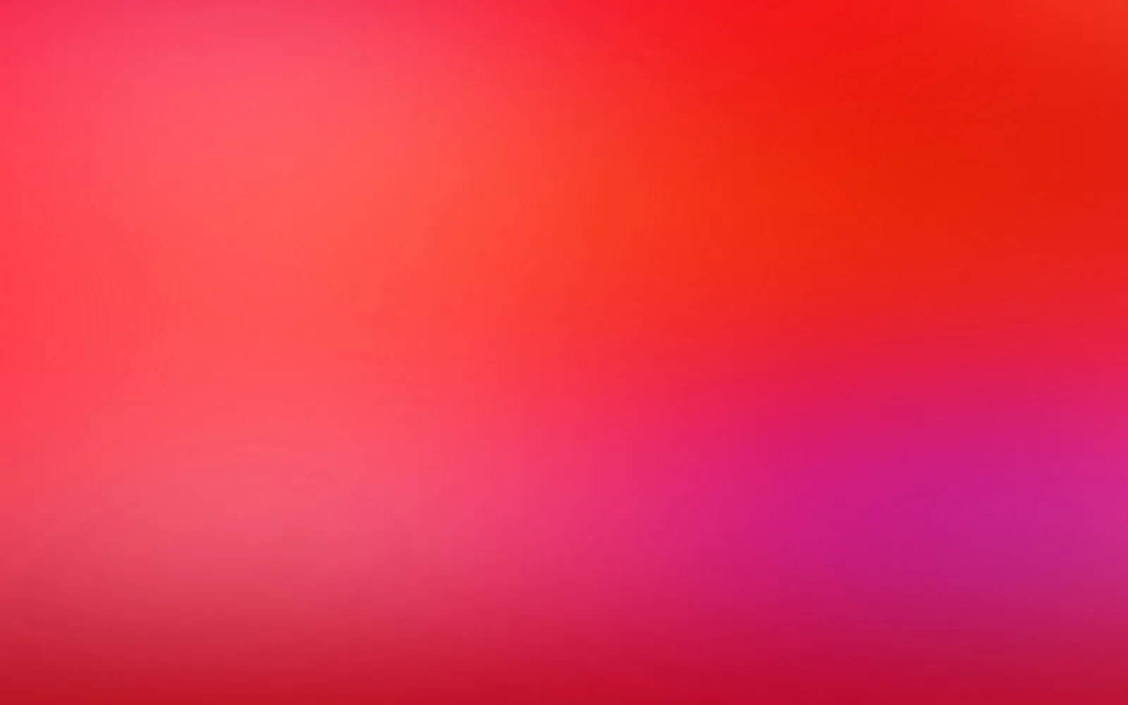 Unscharfer Verlauf von Rot über Pink bis Magenta, oben rechts intensiver, unten dunkler