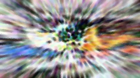 Abstraktes Bild mit radialen, bunten Schlieren in Grün, Gelb, Blau und Violett, die von einem dunklen Zentrum nach außen strahlen.