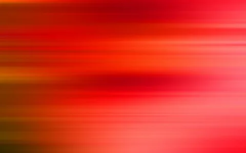 Abstrakte Komposition aus horizontalen, verwischten Streifen in Rot-, Orange- und Pinktönen, dunklere Bereiche links und in der Bildmitte, helle Zonen rechts unten.