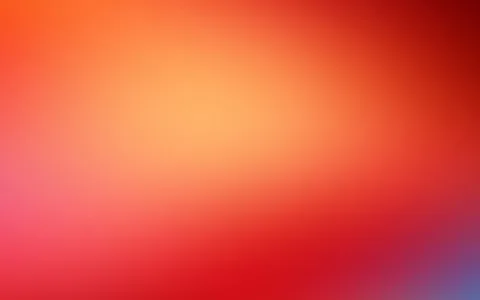 Weicher Farbverlauf von hellem Orange in der Bildmitte über Rot bis zu Dunkelrot in der oberen rechten Ecke und Violettblau in der unteren rechten Ecke.