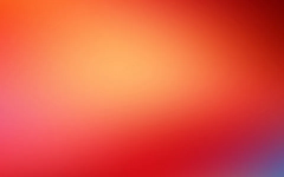 Weicher Farbverlauf von hellem Orange in der Bildmitte über Rot bis zu Dunkelrot in der oberen rechten Ecke und Violettblau in der unteren rechten Ecke.