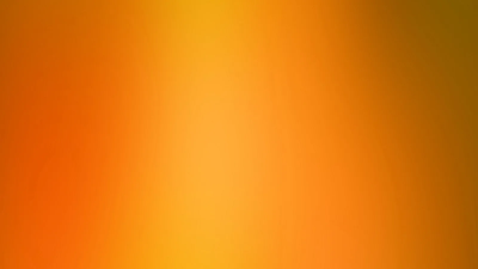 Weicher Farbverlauf in Orange und Gelb, in der Mitte am hellsten, zu den Rändern hin dunkler und leicht ins Braune übergehend.