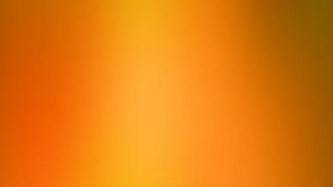 Weicher Farbverlauf in Orange und Gelb, in der Mitte am hellsten, zu den Rändern hin dunkler und leicht ins Braune übergehend.