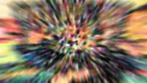 Abstraktes Bild mit bunten, unscharfen Strahlen, die von einem hellen Zentrum nach außen schießen, in Regenbogenfarben mit Mosaikstruktur.
