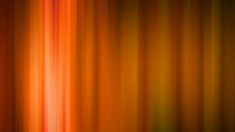 Vertikal verlaufende, unscharfe Streifen in Orange, Rot und Ockergelb, die von links hell leuchtend nach rechts dunkler werden.
