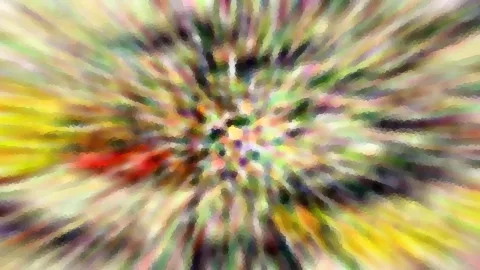 Abstraktes Bild mit radial verlaufenden Farbstreifen in Gelb, Grün und Rot, die von einem bunten Zentrum nach außen laufen.