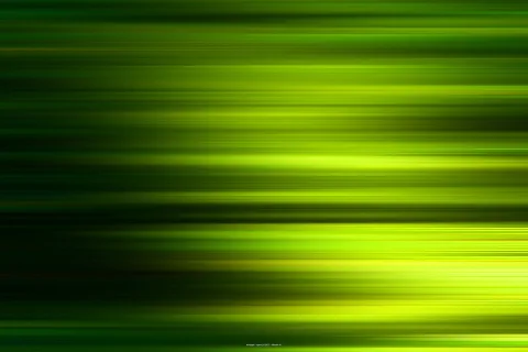 Horizontale grüne und gelbgrüne Lichtstreifen vor dunklem Hintergrund, verwischt wie bei einer Bewegungsaufnahme.