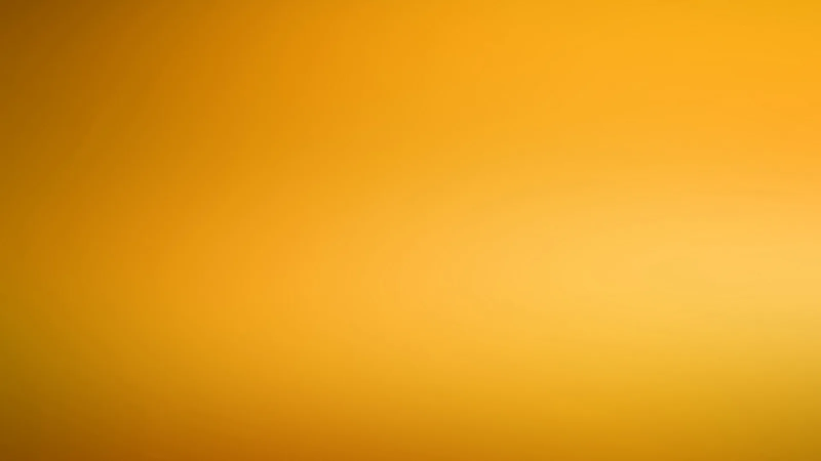 Weicher Farbverlauf in Orange und Gelb, rechts heller, links und unten dunkler, ohne erkennbare Motive.