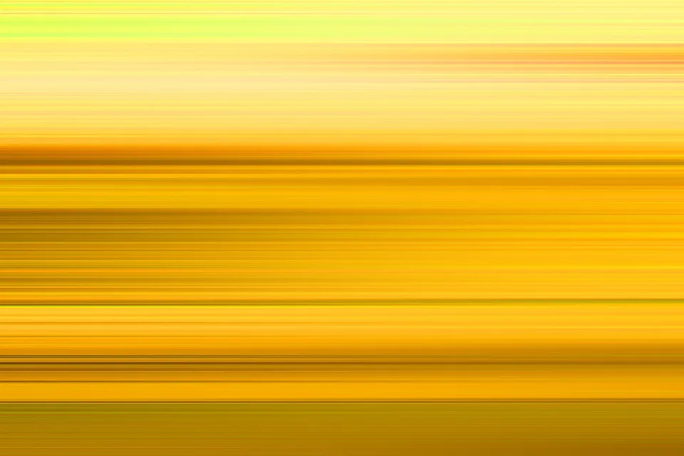 Horizontale Streifen in Gelb, Orange und Hellgrün, wie durch Bewegungsunschärfe verwischt