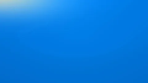 Gleichmäßiger blauer Farbverlauf, oben links ein heller gelblicher Lichtschein, nach unten zunehmend dunkler.