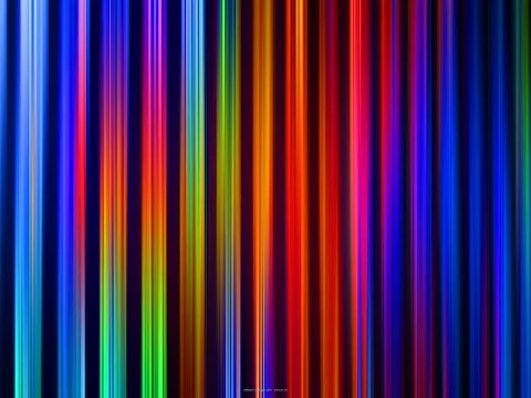 Vertikale, unscharf verlaufende Streifen in Blau, Rot, Orange, Grün und Violett auf dunklem Grund.