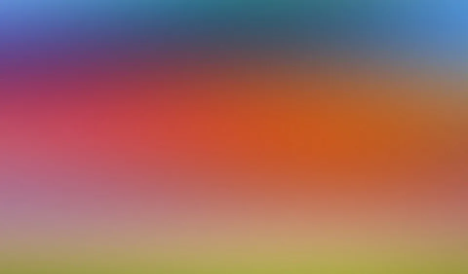 Weicher Farbverlauf von Blau und Violett oben über Rot und Orange bis zu Gelbgrün am unteren Rand.