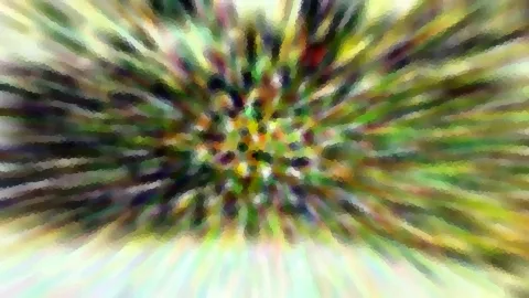 Abstrakte Komposition aus farbigen Streifen in Grün, Gelb und Violett, die vom Zentrum radial nach außen laufen. Die Kanten wirken pixelig und verwischt.