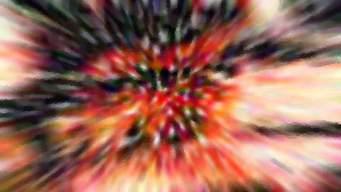 Abstraktes Bild mit bunten, radial von einem dunklen Zentrum in der Mitte nach außen laufenden Farbstreifen in Rot, Orange, Grün und Weiß.