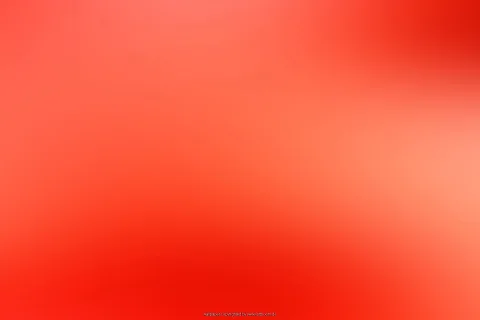 Weich verschwommene Farbfläche in Rot und Orange, heller im rechten Bereich, dunkler Rotton am unteren Rand.