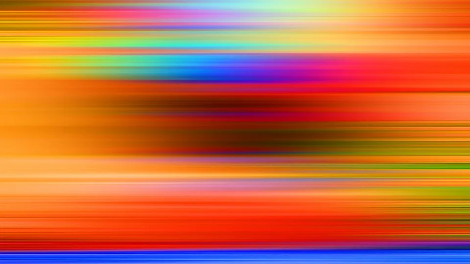Horizontal verwischte Streifen in Orange, Rot, Blau, Grün und Gelb, dazwischen ein dunkler Bereich.