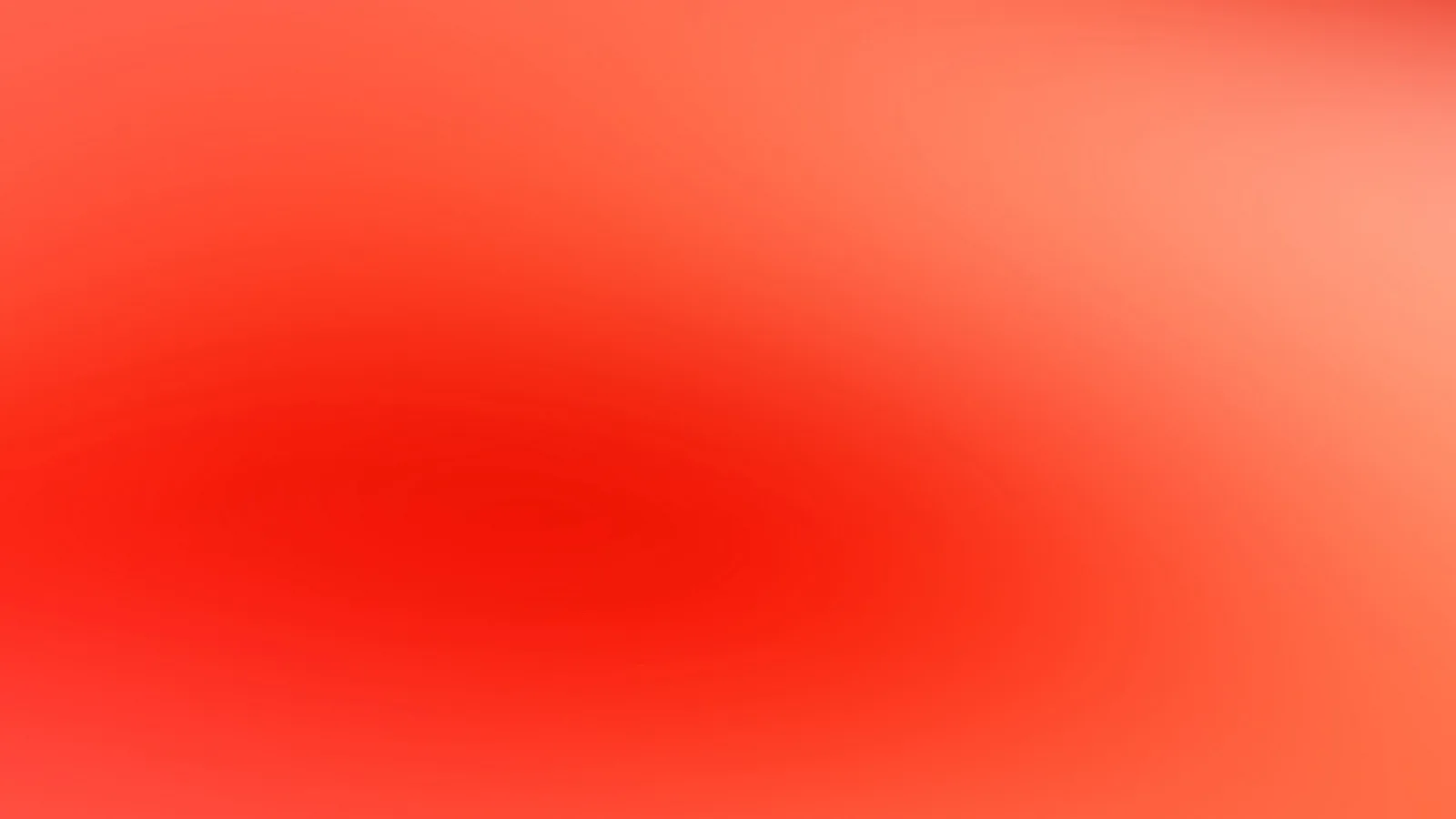 Unscharfer Verlauf in Rot und Orange, im Zentrum dunkler rot, zum rechten oberen Rand heller werdend.