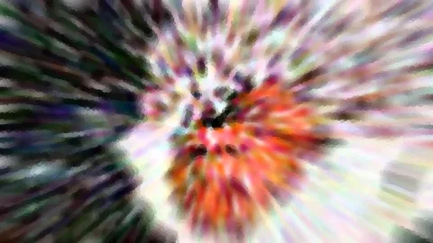 Abstrakte radiale Unschärfe mit orangefarbenem Zentrum, umgeben von grünen, violetten und weißen Streifen.