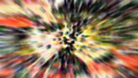 Abstraktes Bild mit farbigen Streifen, die von einem hellen Zentrum in der Mitte radial nach außen strahlen, in Rot, Gelb, Grün und Dunkelblau, leicht verpixelt.