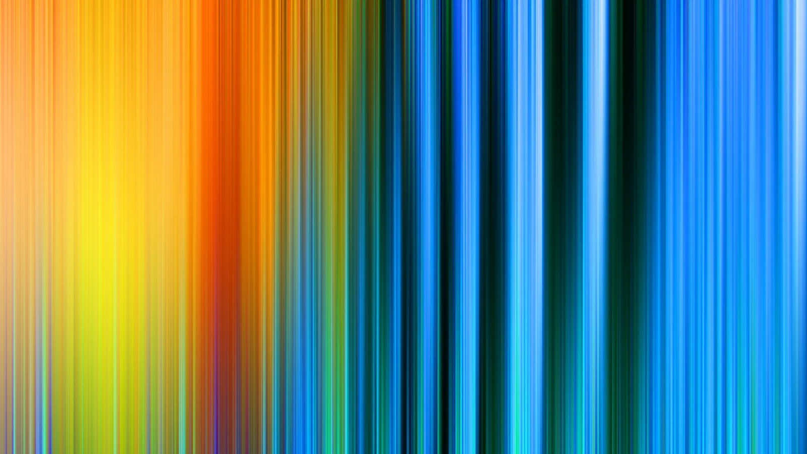 Vertikal verwischte Farbstreifen laufen von Orange und Gelb über Rot und Grün zu einem tiefen Blau an der rechten Seite.