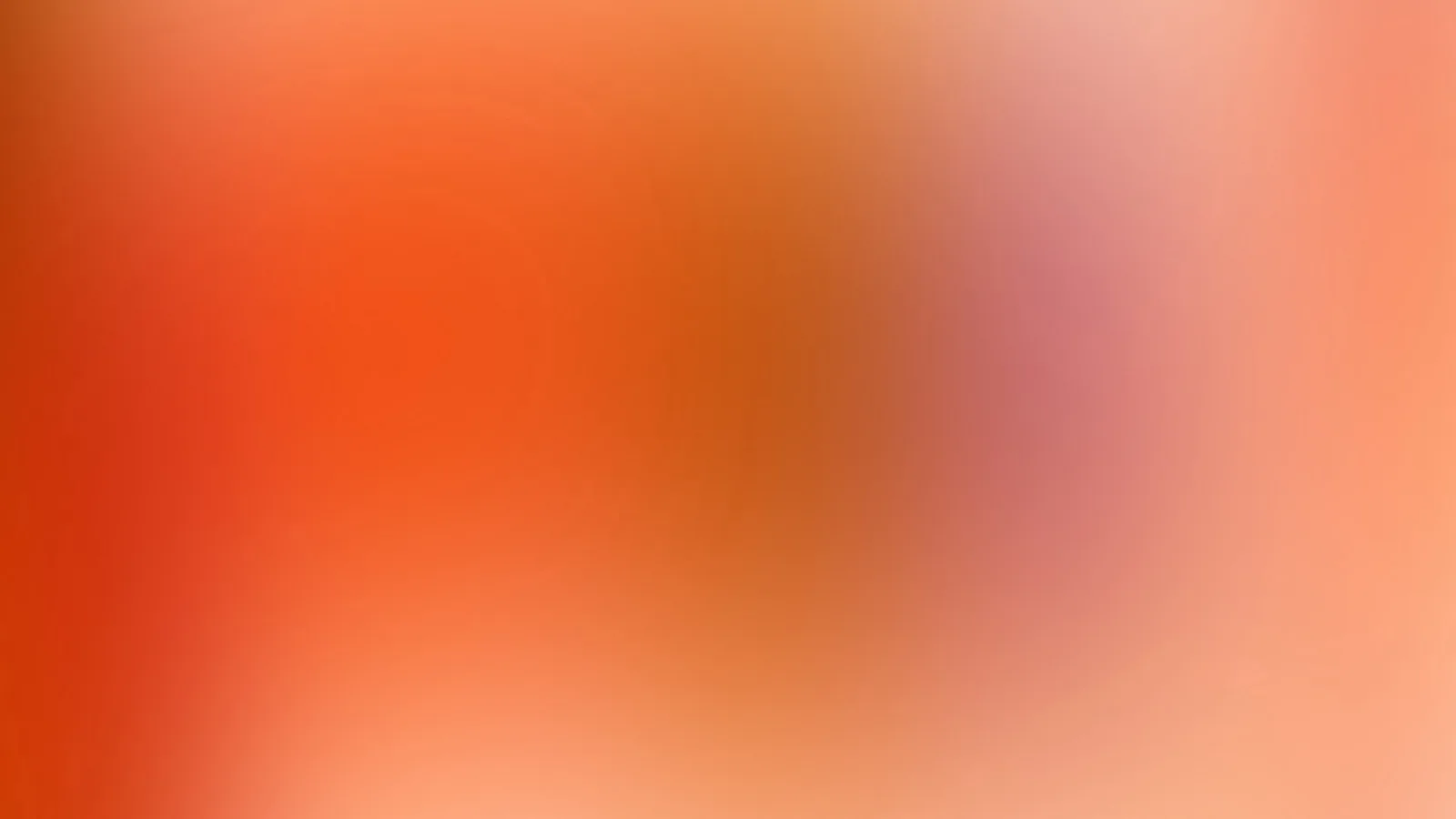 Unscharfer Verlauf von Orangerot über Rosa zu hellem Pfirsichton