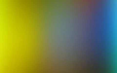 Unscharfer Verlauf von Gelb über Grüngrau zu Blau, unten dunkles Braun.