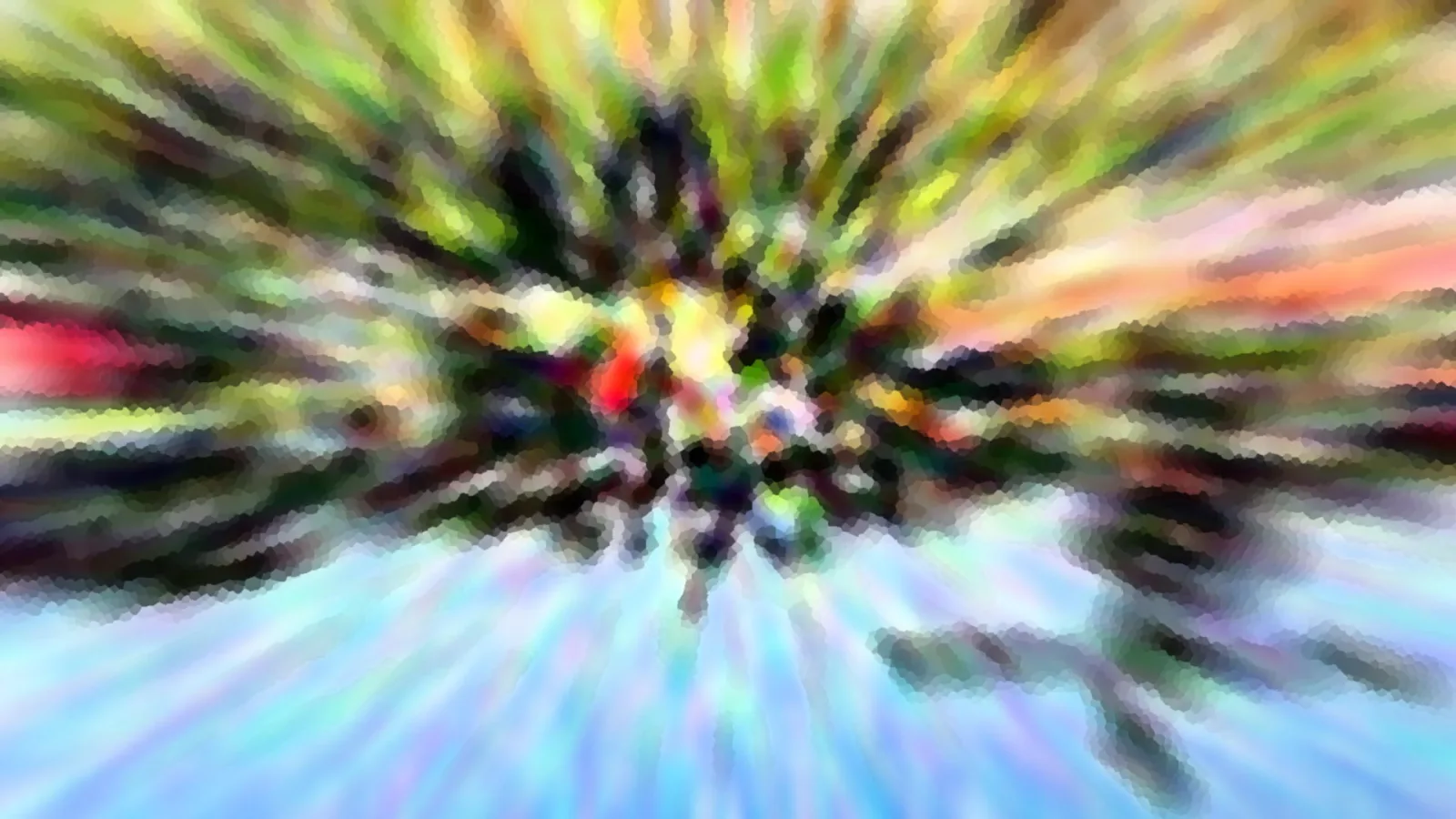 Abstrakte Aufnahme mit radialer Bewegungsunschärfe, die von einem hellen Zentrum in Grün-, Gelb- und Rottönen ausstrahlt, unten in blassem Blau.