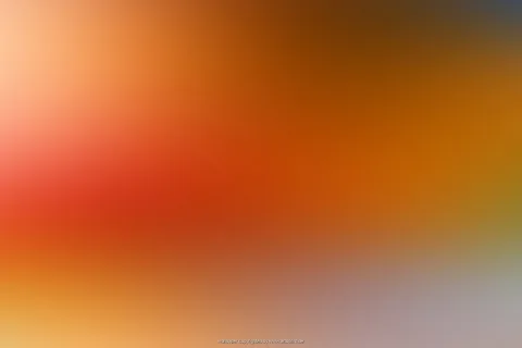 Weicher Farbverlauf von hellem Apricot links oben über Rotorange in der Bildmitte bis zu dunklem Braun oben rechts und grauem Violett unten rechts.