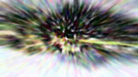 Verwischte, radial von der Mitte ausstrahlende Streifen in Grün, Lila und Weiß mit mosaikartiger Pixelstruktur.