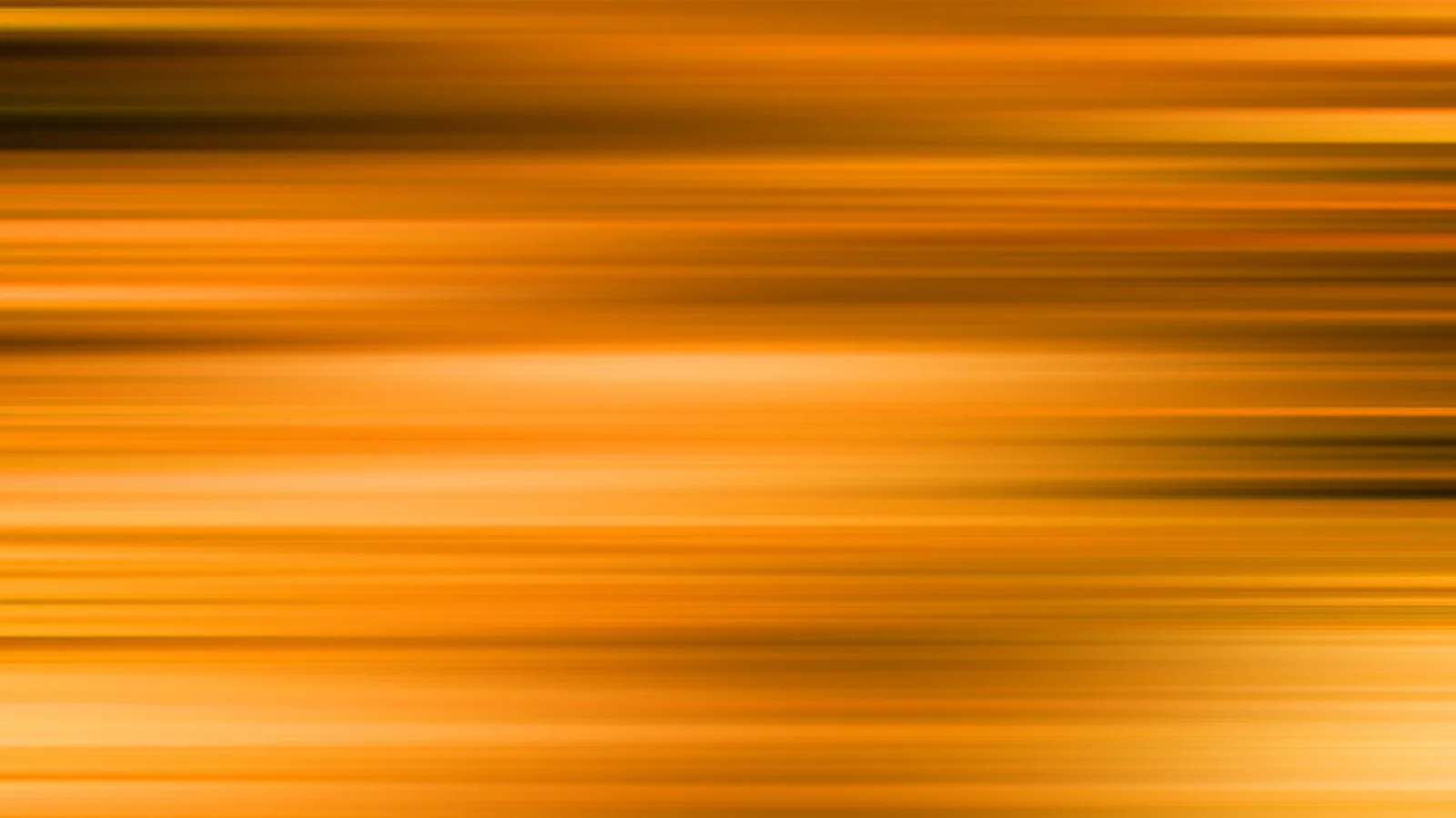 Horizontale, verwischte Streifen in Orange, Gelb und Dunkelbraun, die von links nach rechts verlaufen.