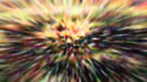 Abstrakte Komposition aus bunten Schlieren, die von einer hellen gelben Mitte radial nach außen laufen.
