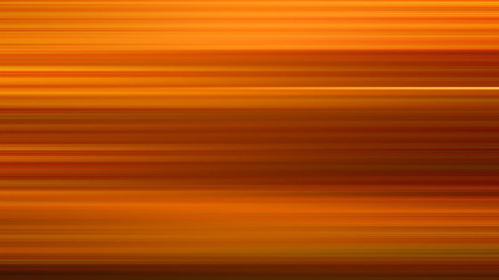 Horizontal verwischte Linien in Orange, Gelb und Braun, die von oben nach unten dichter und dunkler werden.