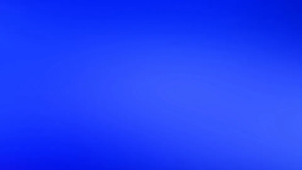 Gleichmäßiger Verlauf von tiefem Blau zu hellerem Blau, ohne erkennbare Motive.