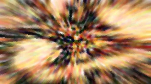 Abstraktes Bild mit radial verlaufenden, bunten Streifen in Gelb, Orange, Rot und Grün, die sich in der Mitte zu einem dunklen Zentrum bündeln.